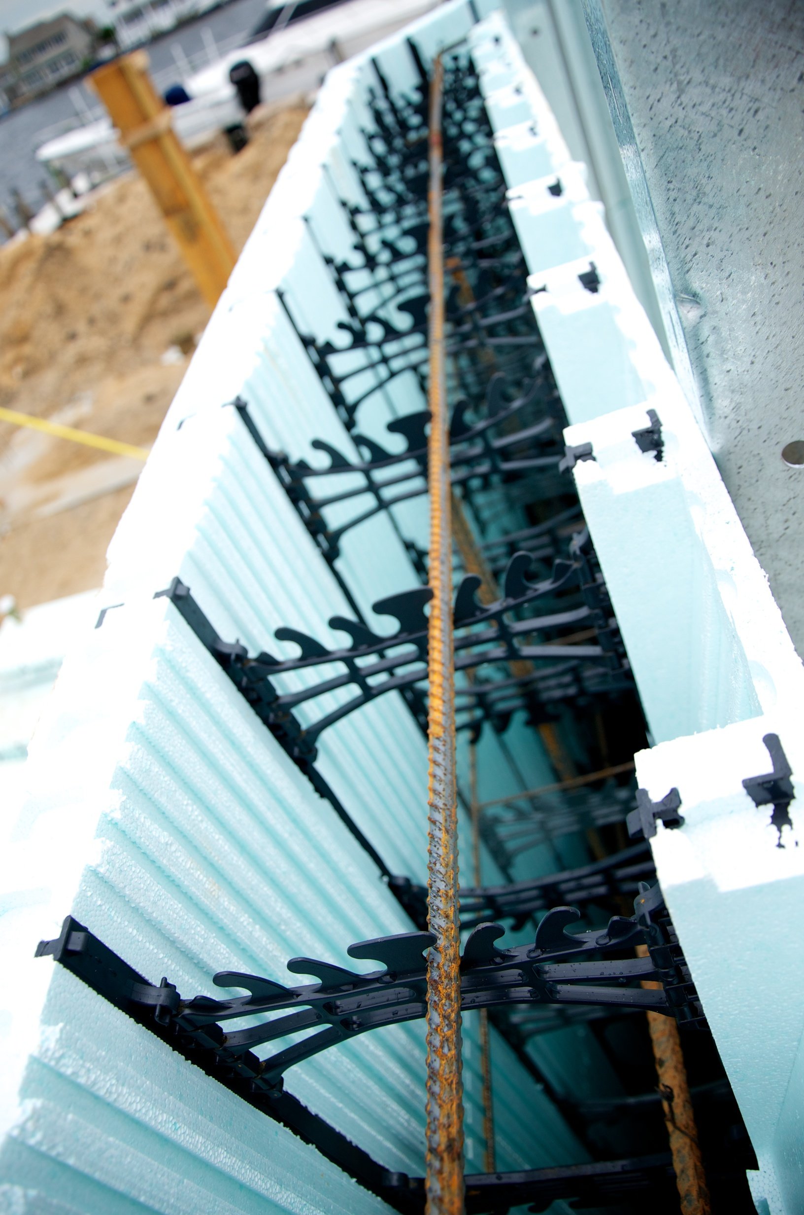 Foundation concrete piers and ICF wall forms going up at a Normandy Beach hurricane-proof rebuild